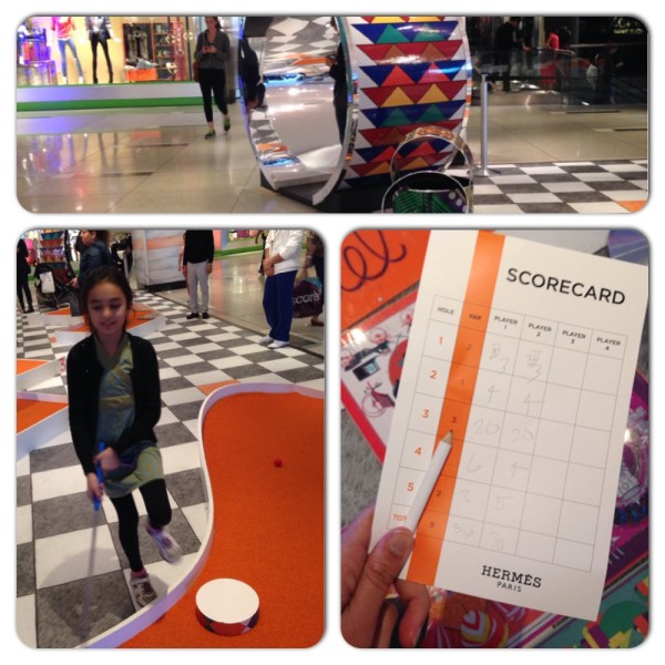 After swimming and art we played Hermes golf at Time Warner Center. Clearly we both need golf lessons.